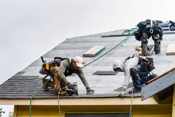 Professional Roofing technician working in Howard, PA